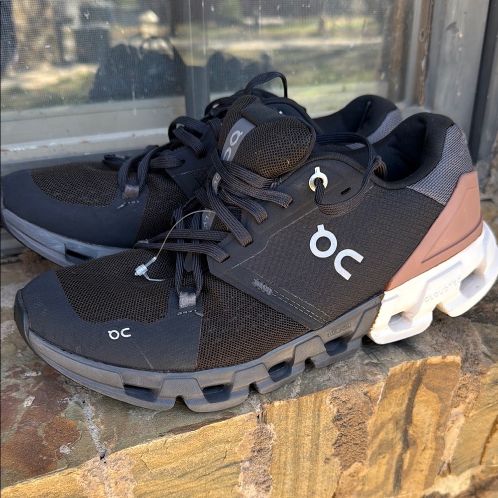 On Running Black and Gray Athletic Shoes with CloudTec Cushioning